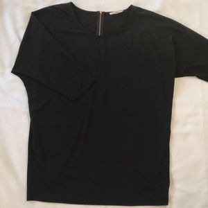 Black tunic with gold zipper